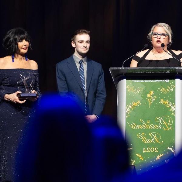 Award winner Michelle Rhodes on stage at the President's Ball